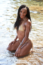 Crystal Dunn was photographed by Ben Watts in St. Lucia for Sports Illustrated. Swimsuit by Pistol Panties by Deborah Fleming